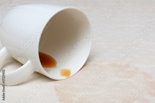 Liquid is left out of a mug on the mairas, a stain on the mattress due to spilled coffee