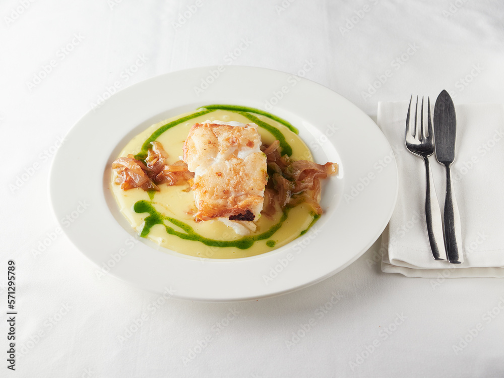 cod dish with creamy sauce and caramelized onions cod dish with creamy sauce and caramelized onions