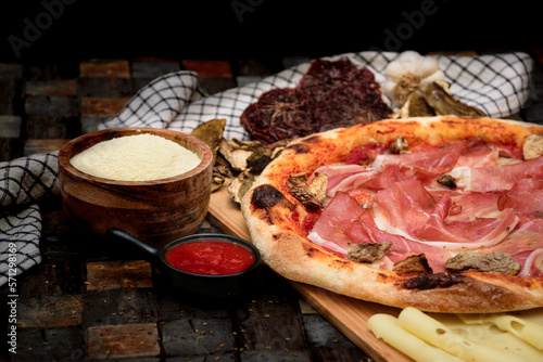 Speck Italian pizza at restaurant photo