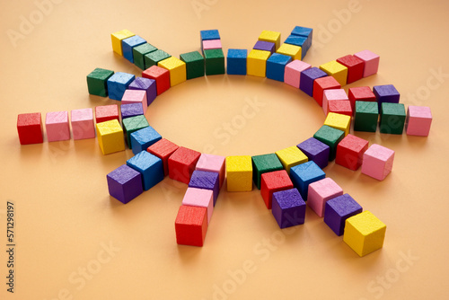 A circle of colored cubes as an abstract concept of interaction, management and connections. photo