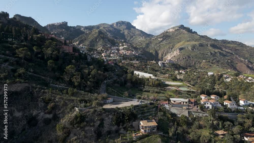 Aerial view of Taormina, a touristic town on mountain top near Messina, Sicily, Italy. Aerial view of Taormina, a touristic town on mountain top near Messina, Sicily, Italy.