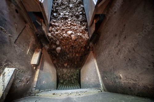 Soil falls from conveyor of crushing and sorting complex