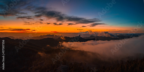Magical sunset above the clouds with Teide volcano on the horizon. Sunset cinematic view from the top of Gran Canaria Island Pico de las Nieves point.
