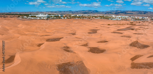 Panoramic aerial scene of the Maspalomas Dunes in Playa del Ingles, Maspalomas, Gran Canaria, Spain. Endless desert sands. Magical safari dunes.