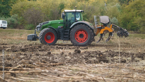 Tractor working in the field. Autumn tillage. Deep ripping with powerful tractor © Юрій Тарасовський