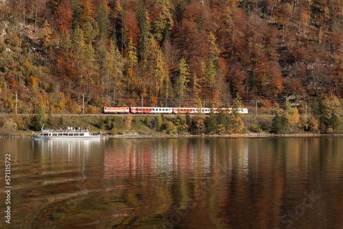 hallsttat mountain village surrounded by lakes and trees in autumn