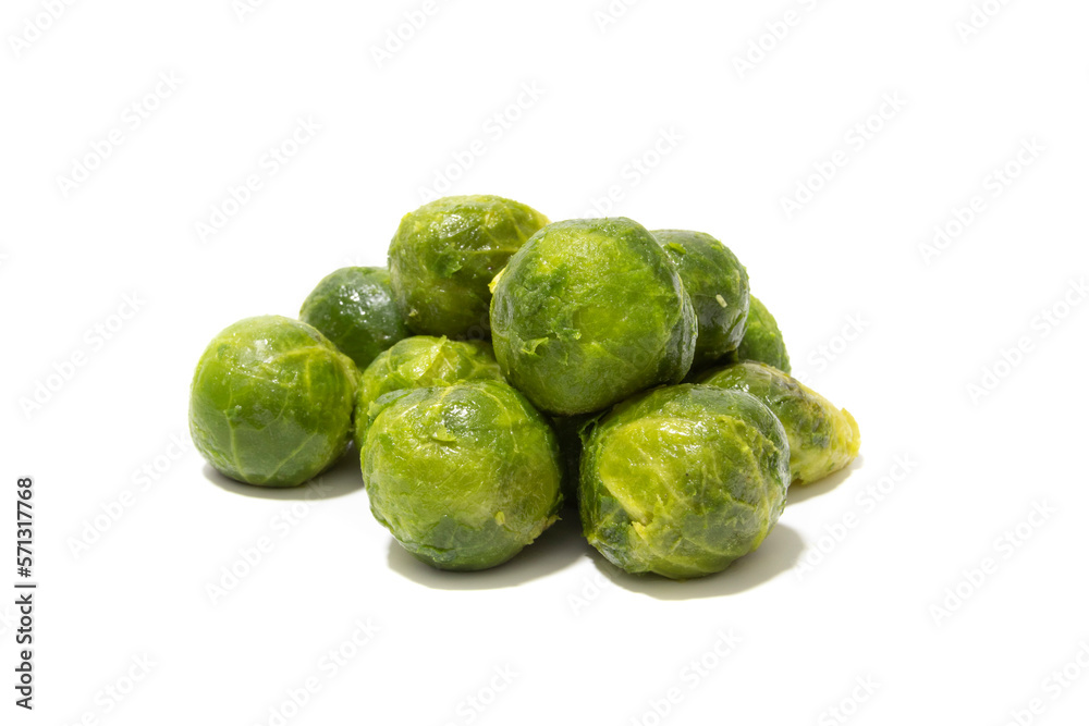 Lots of cooked brussels sprouts. Isolated on a white background. Healthy food concept. Lots of cooked brussels sprouts. Isolated on a white background. Healthy food concept.