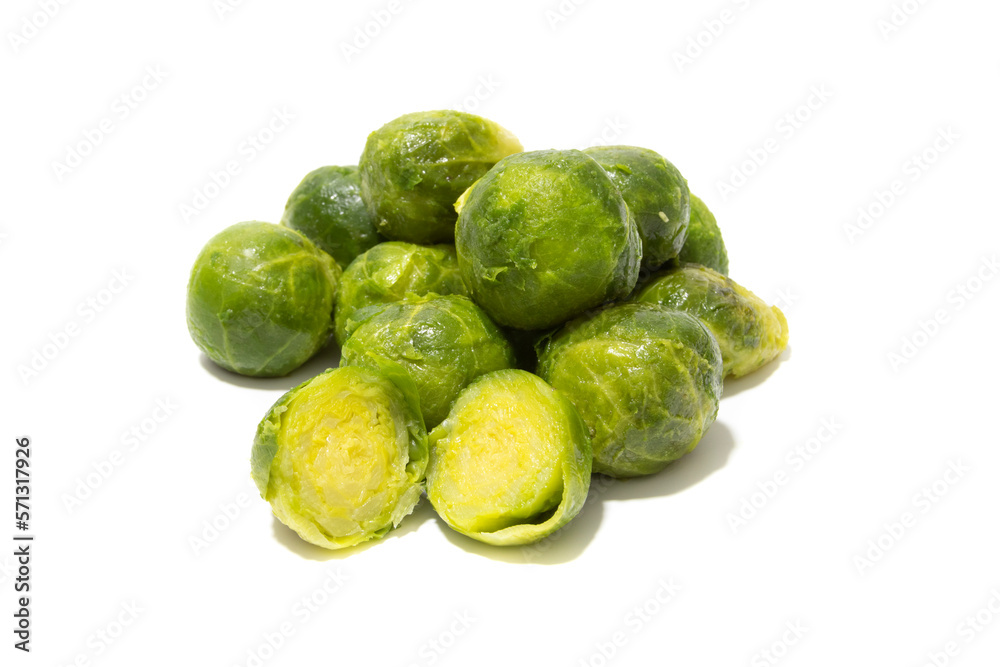 Lots of cooked brussels sprouts. Isolated on a white background. Healthy food concept. Lots of cooked brussels sprouts. Isolated on a white background. Healthy food concept.