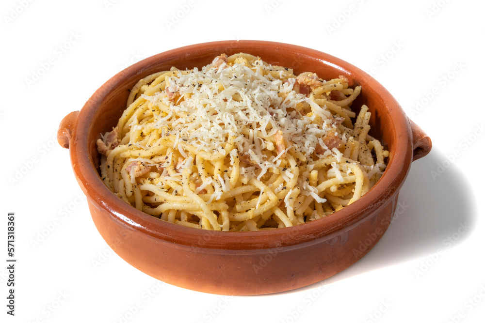 Spaghetti carbonara with grated cheese, served in a clay bowl. Isolated on white background. Italian food concept. Spaghetti carbonara with grated cheese, served in a clay bowl. Isolated on white background. Italian food concept.
