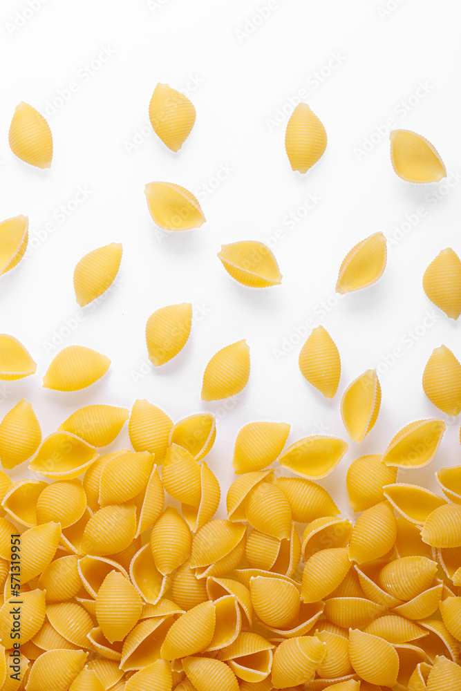 Pasta products in the form of a shell, texture, on a white background Pasta products in the form of a shell, texture, on a white background