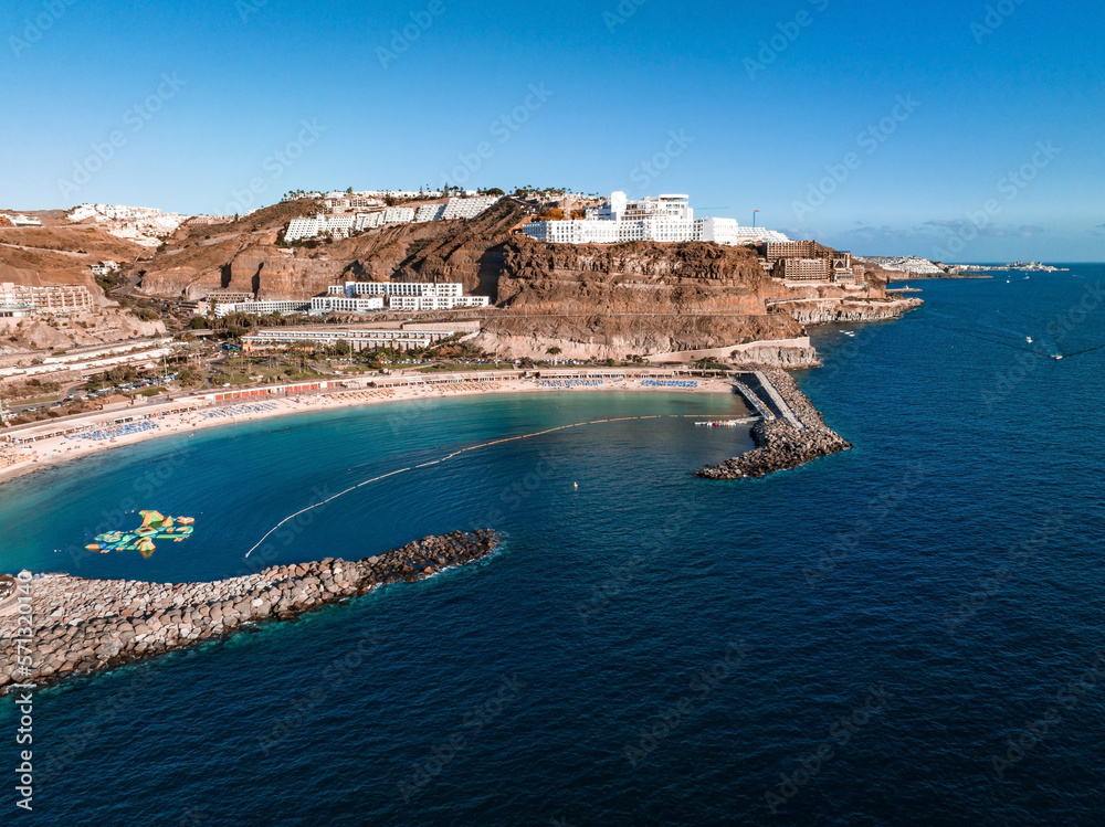 Beautiful aerial view of the island of Gran Canaria. Magical cliffs by the Atlantic ocean, small buildings and natural landscape. 