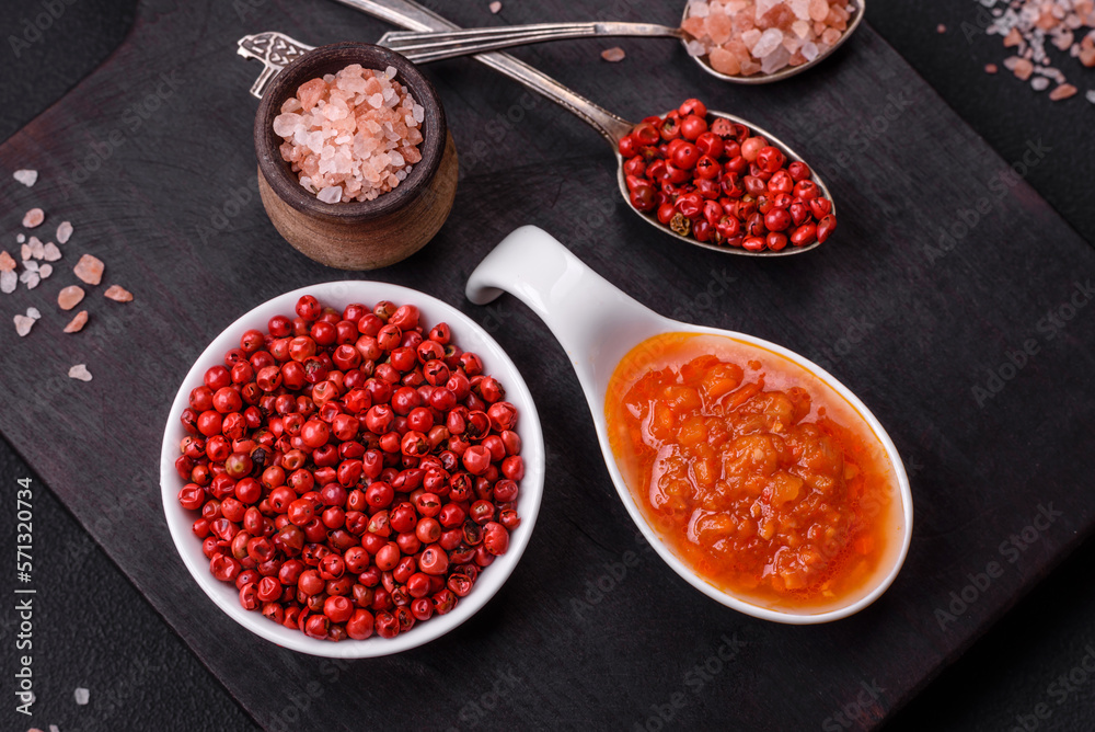 Red adjika sauce or ketchup with spices and herbs Red adjika sauce or ketchup with spices and herbs