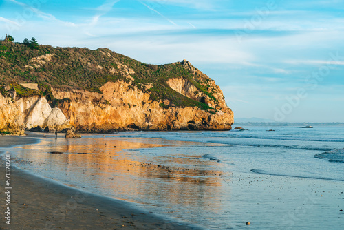 Avila Beach rocky cliffs at sunset, and ocean view with beautiful cloudy sky in the background, Central Coast of California
