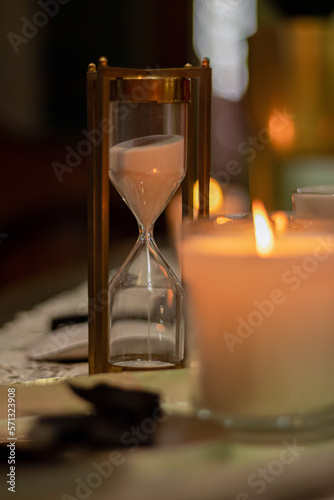 hourglass with candle light