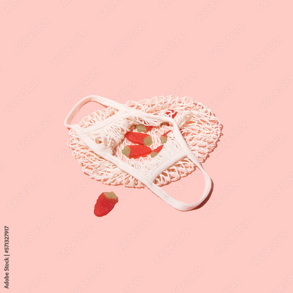 Gummy candy, strawberry shape and flavor in a retro style mesh bag ...
