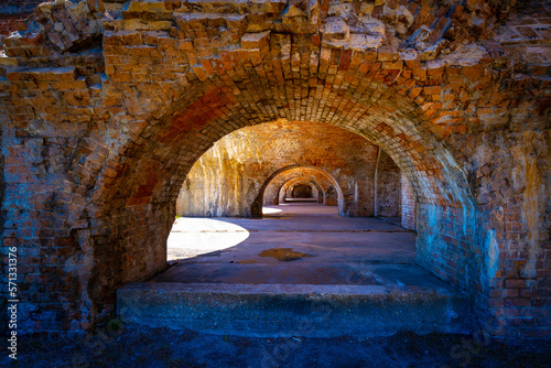 Fort Pickens Historic Arches, landmark ruins of red brick structures for sightseeing and tourist destination in Pensacola, Florida, USA © Naya Na