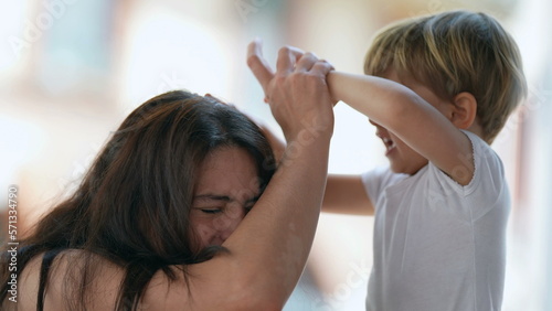 Photography Mischievous child hurting mother