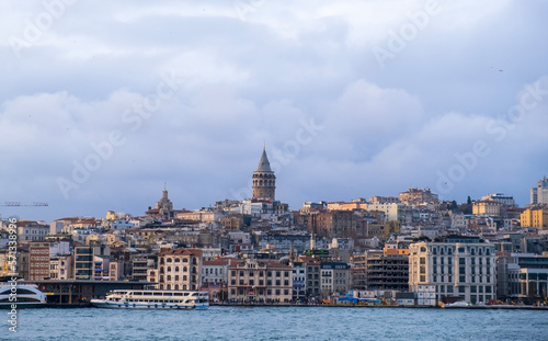 sunset view in istanbul bosphorus. Red sunset in Istanbul. Historical Galata tower and istanbul silhouette. View of the Galata Tower in Beyoglu district at sunset along the Golden Horn in Istanbul.   © M.Nergiz
