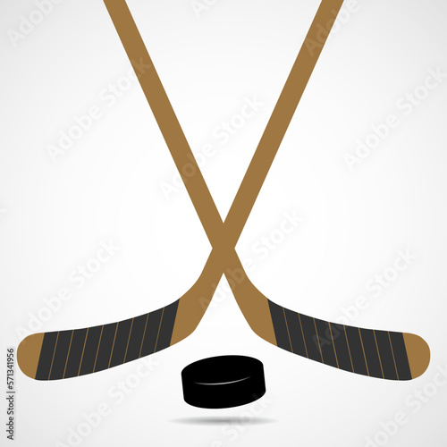 Hockey sticks and puck isolated on white background