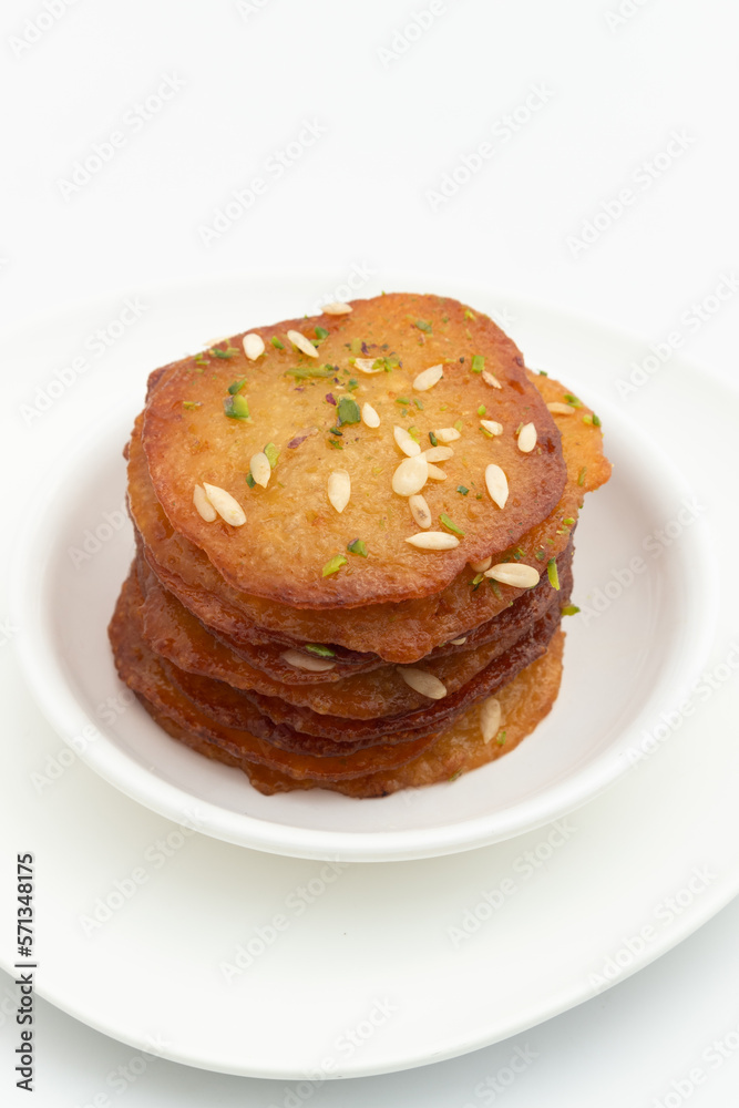 Malpua Or Pua Are Traditional Indian Sweet Mithai Pancakes Drenched, Dunked, Soaked Or Coated With Sugar Syrup Cheeni Ki Chasni And Pistachio Malpua Or Pua Are Traditional Indian Sweet Mithai Pancakes Drenched, Dunked, Soaked Or Coated With Sugar Syrup Cheeni Ki Chasni And Pistachio