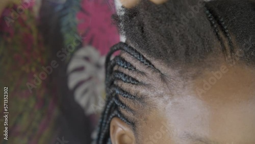 African beauty getting a beautiful hairstyle