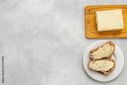 Slice of bread with butter, top view. Sandwiches with butter