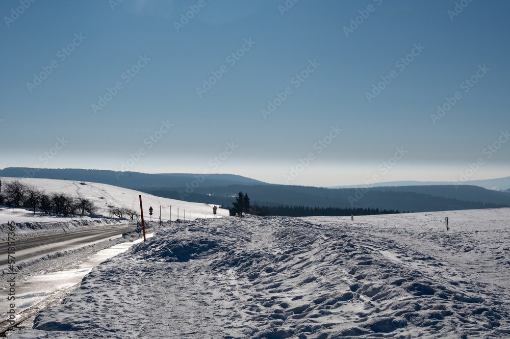 Road on the Wasserkuppe in winter with lots of snow