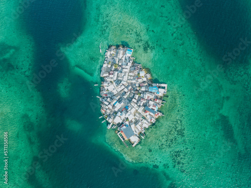Photography from the air made on a mavic air drone on a sunny day with turquoise water. The most populated island in the world is called Santa Cruz del Islote, which is located in Colombia