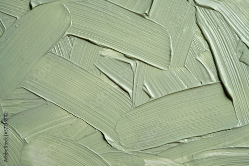 Green cosmetic clay texture close up. Cosmetics texture mask clay for face and body