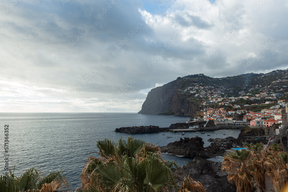Amazing Portugal, Madeira island with mountains, ocean, palm trees and Camara de Lobos fishing village