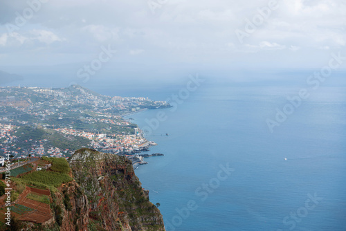 Amazing scenery with ocean, mountain and city of Funchal on the island of Madeira, aerial view. Cabo Girão is the second highest viewpoint in the world, at 580 meters high with fantastic panoramic photo