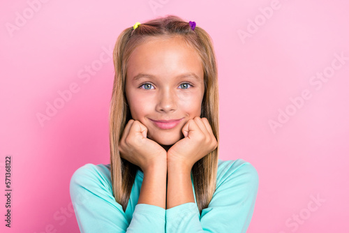 Closeup photo of young little schoolkid girl touch cheeks dreamy look you positive comfortable wear blue pullover isolated on bright pink color background