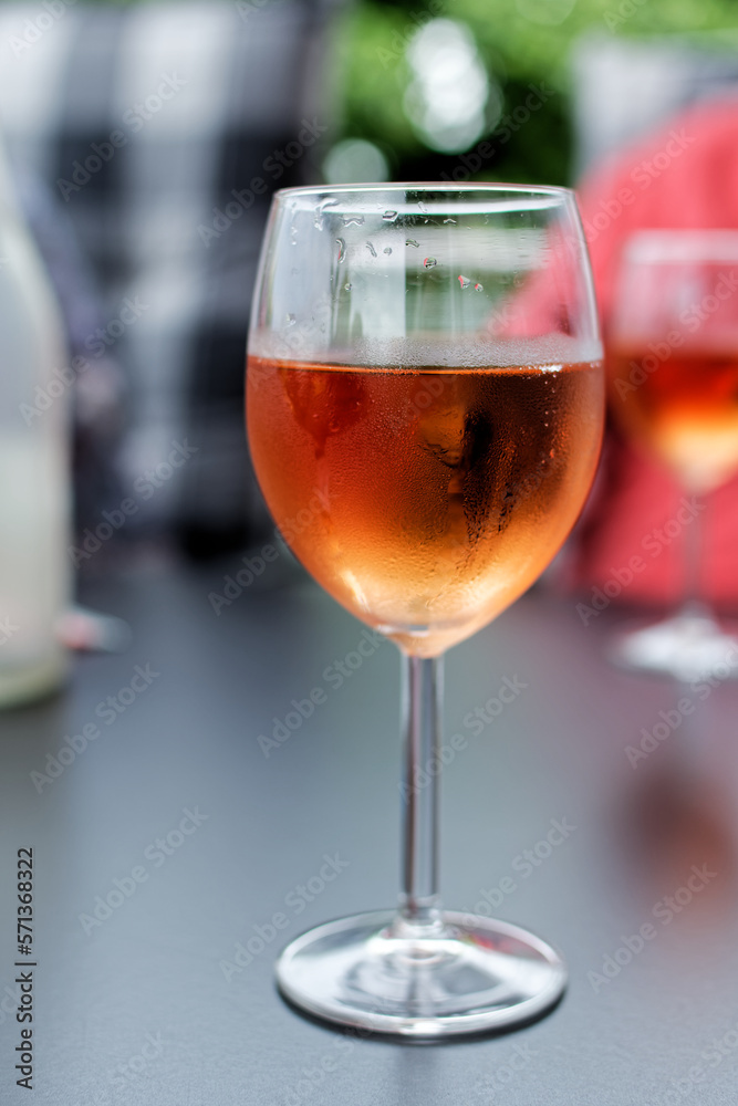 Chilled rose colored drink against blurred background