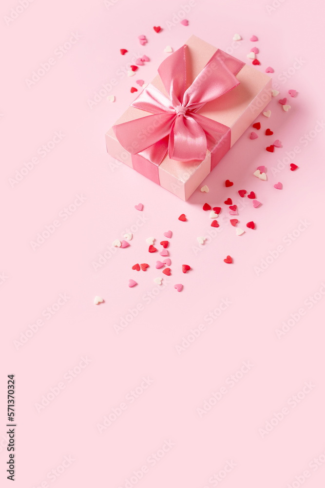 Candy pink confetti with gift box on pink background