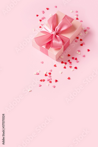 Candy pink confetti with gift box on pink background