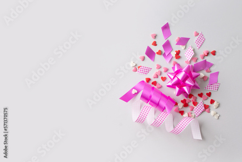 Celebration concept with pink confetti and event decoration on white background