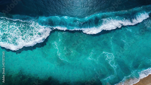 An aerial view of a blue sea with water textures  sun reflections  Generative ai