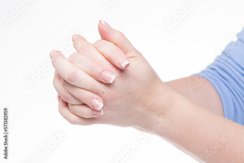 Billede på lærred woman has hands clasped in prayer isolated against white background