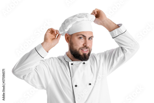 Male baker in uniform on white background