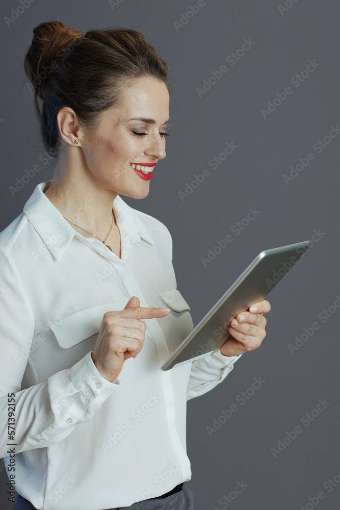 happy modern 40 years old business woman isolated on grey