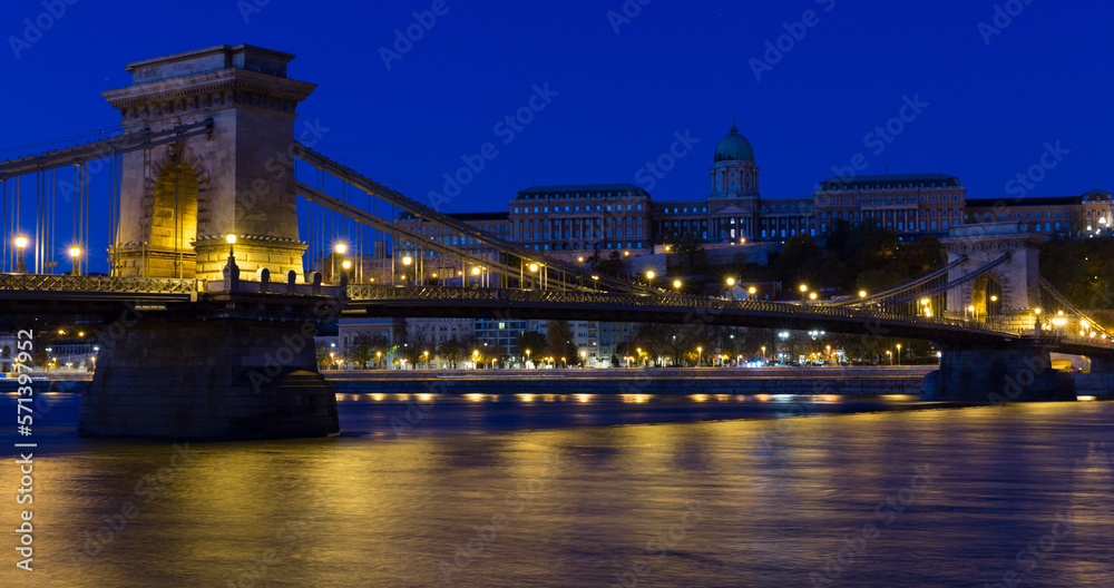 Night light of Chain Bridge near Buda Fortress is hungarian landmark outdoors.