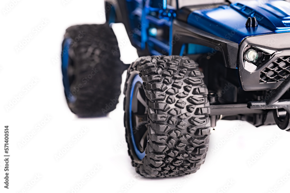 Fototapeta premium Sports SUV with powerful wheel treads. Electric car toy.