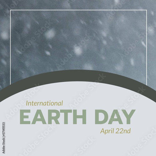 Composite of international earth day and april 22nd text in gray curve and defocused snowfall