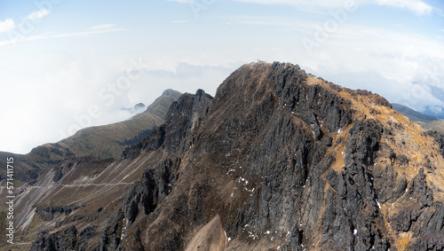 Nature background: an aerial view of rocky mountains at the top of an extinct volcano Rucu Pichincha in Ecuador, South America