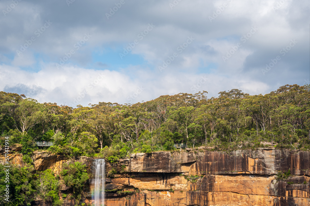 Close-up view with a rainbow at Fitzroy Falls in Morton National Park in Kangaroo Valley, Southern Highlands, NSW, Australia.