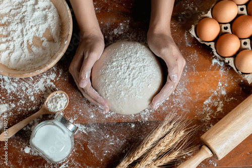 Top View of Asian woman hands prepare and rest the dough before putting the Dough into the oven
