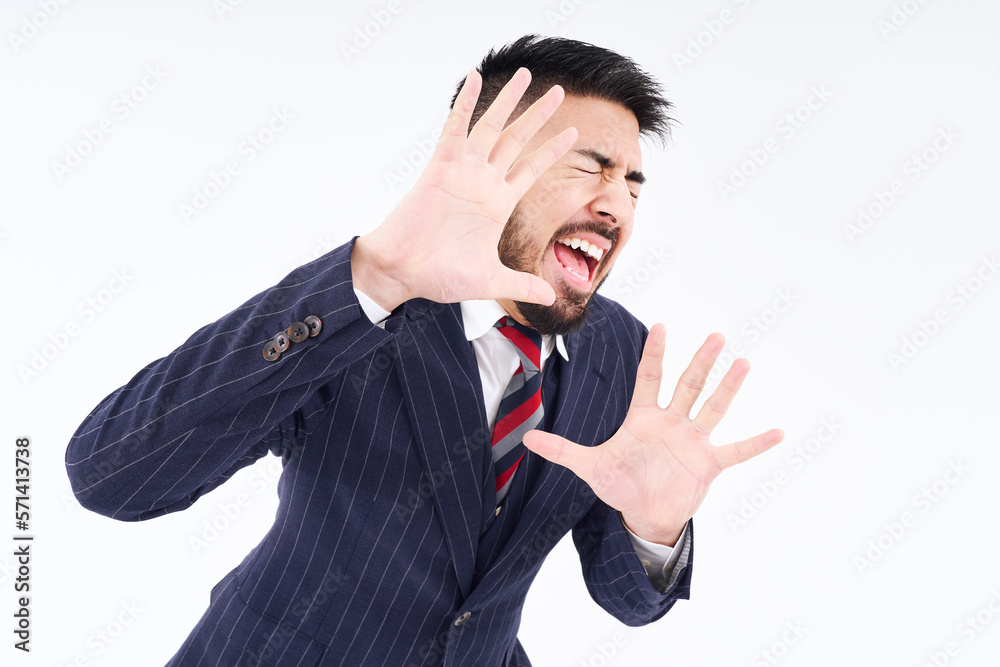 拒絶のポーズをするスーツ姿の男性 Stock Photo | Adobe Stock