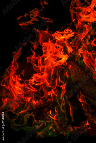  Sparks and flames. Variegated flames and colorful sparks close-up.Multicolored flame.Firewood burning in bonfire.Burning bonfire.magical colorful flame. 