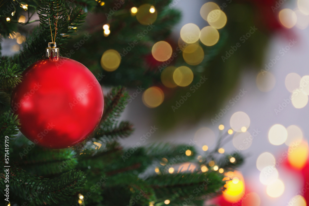 Beautiful Christmas ball hanging on fir tree branch against blurred background, closeup. Space for text Beautiful Christmas ball hanging on fir tree branch against blurred background, closeup. Space for text
