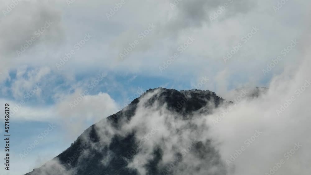 View of the mountains with green forest through the clouds. Negros, Philippines View of the mountains with green forest through the clouds. Negros, Philippines